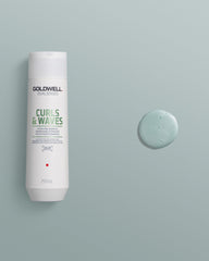 Shampoo on bathroom shelf with styling products showing salon-at-home benefit