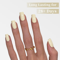 Goolich nail swatch on hand demonstrating glossy pastel yellow manicure durability