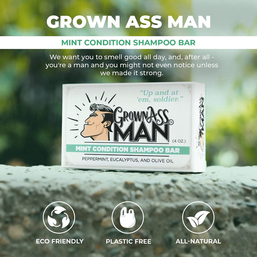 Grown Ass Man Co. shampoo bar in hand showing 4 oz scale and travel benefit