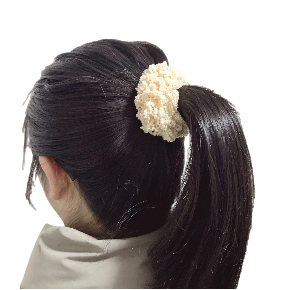 Grutyopkn scrunchies in a handbag for travel-ready hair styling convenience