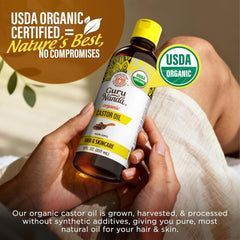 Heap of castor seeds with GuruNanda bottle, highlighting natural source benefit