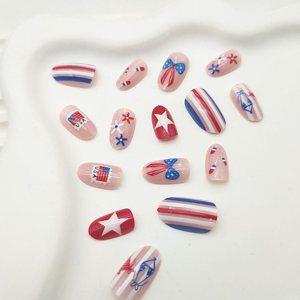 GXOIPNS nails worn on hand in patriotic setting, demonstrating festive short almond-oval fit
