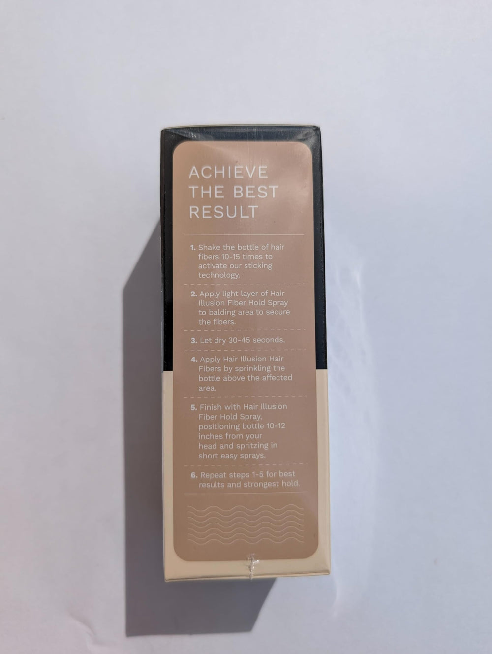 Lifestyle mirror shot with Hair Illusion shows natural finish and confidence benefit