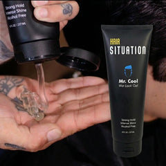 Person styling hair with Hair Situation for a shiny wet look and controlled finish