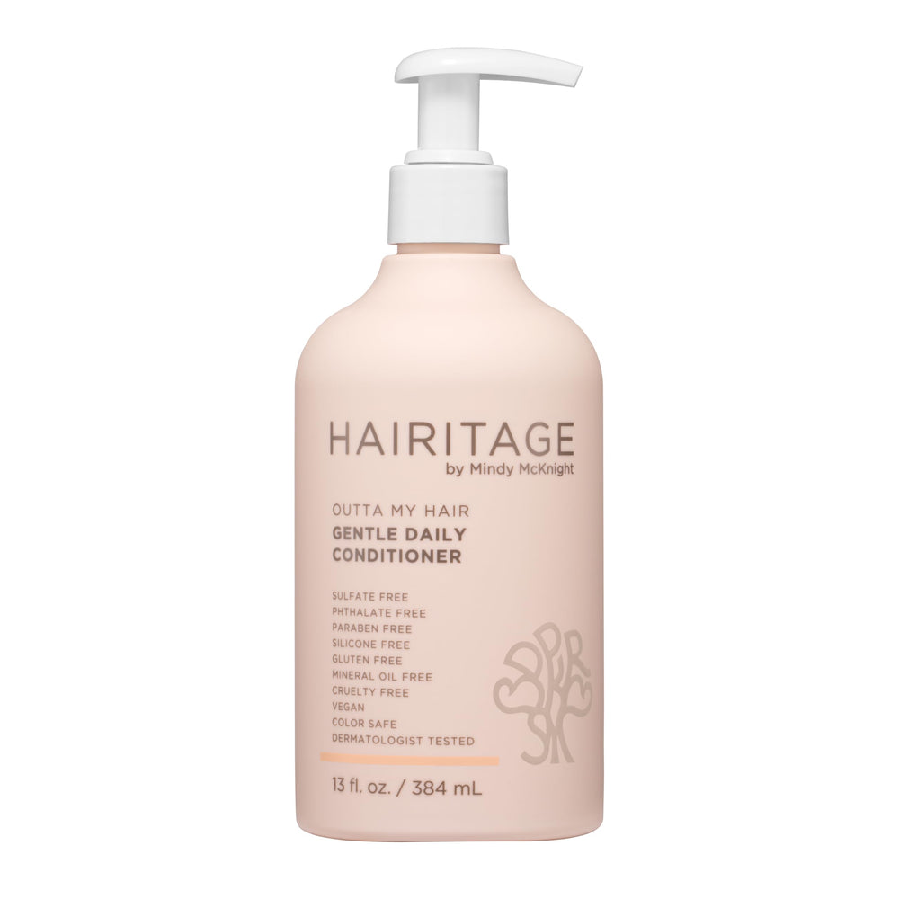 Hairitage front bottle showing cherry amber scent and nourishing formula benefit
