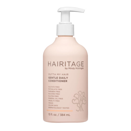 Hairitage front bottle showing cherry amber scent and nourishing formula benefit