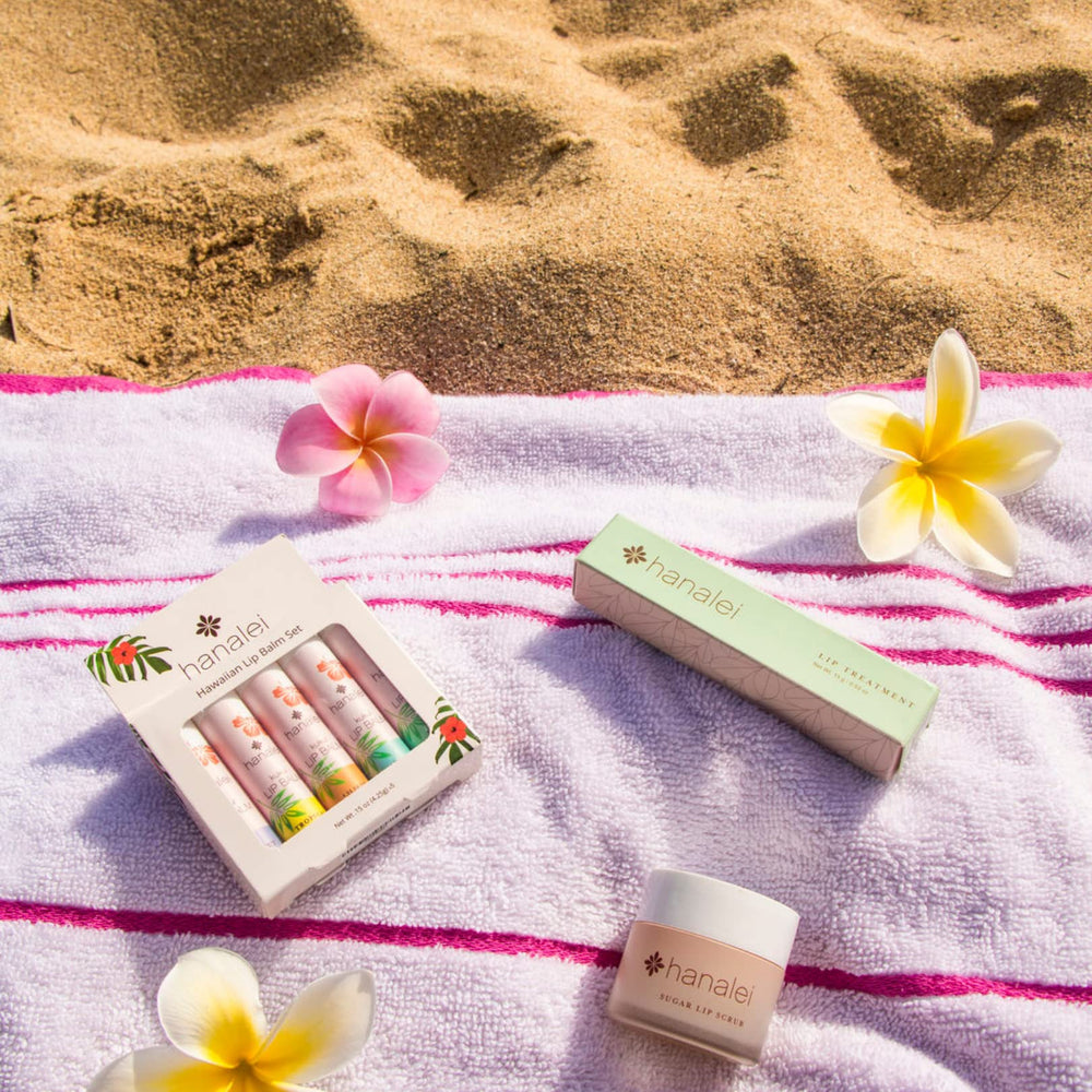 Hanalei lip balm held in hand showing portable size and travel convenience
