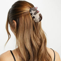 Hapdoo clip worn in hair showing practical everyday updo and stylish accent