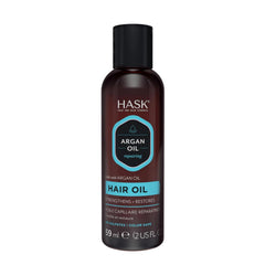 HASK oil rubbed into hands demonstrating even spread and non-greasy finish