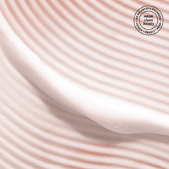 HASK being applied to wet hair to detangle and hydrate strands