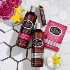 HASK keratin oil on bathroom counter lifestyle scene for convenient use benefit