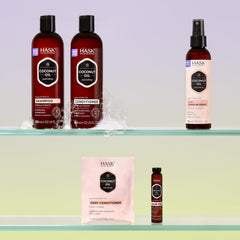 HASK Monoi coconut oil shampoo displayed with coconuts and tiare flowers for nourishing imagery