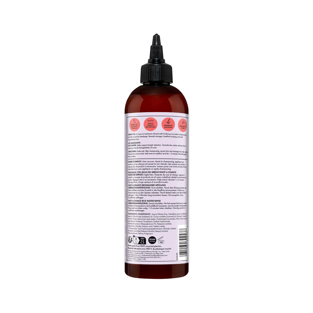 HASK bottle held in hand to show 12 fl oz scale and travel-friendly size