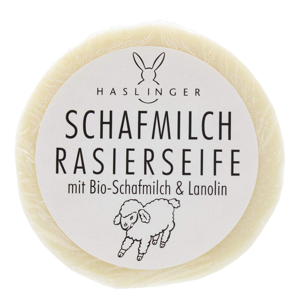 Haslinger shaving soap puck front view showing label and benefits