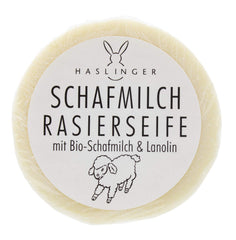 Haslinger shaving soap puck front view showing label and benefits
