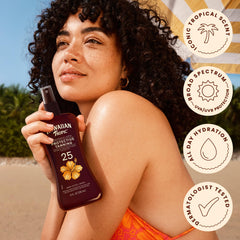 Hawaiian Tropic bottle held in hand showing 8 fl oz size and portability benefit
