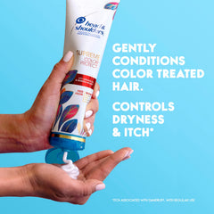 Head & Shoulders bottle in hand showing 9.4 fl oz scale