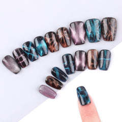 heemeei magnet held over nail demonstrating how to form cat-eye effect quickly