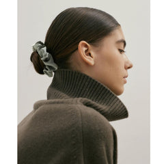 Helamvly scrunchie in a ponytail on model showing secure hold and polished look