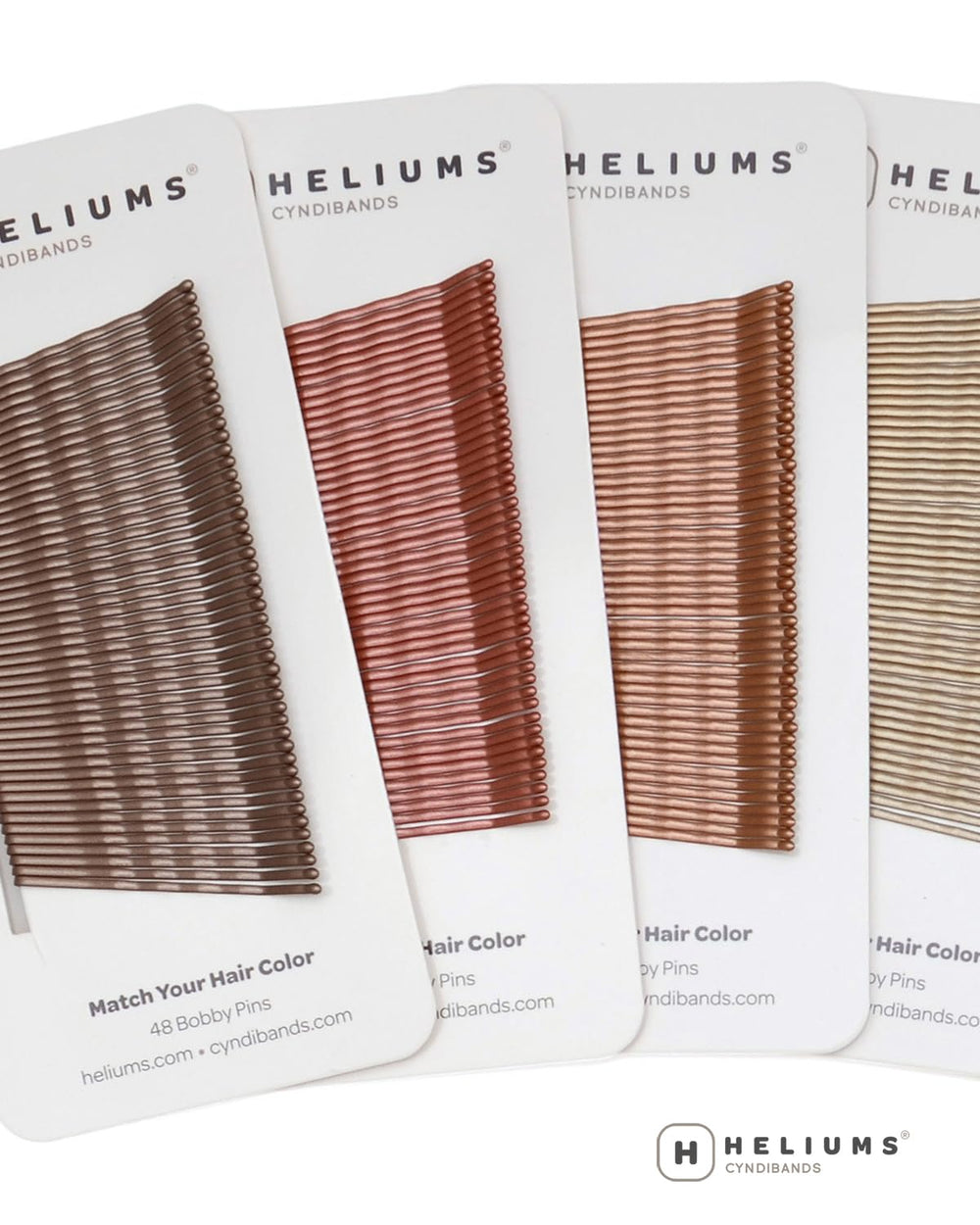 Heliums pins in a stylist kit portraying professional, color-matched tools