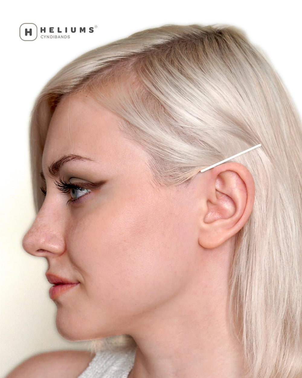 Heliums pins securing flyaways in hair for tidy, long-lasting styling