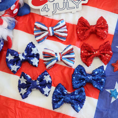 HELYKAKA bow worn at a family picnic showing patriotic styling and photo-ready look