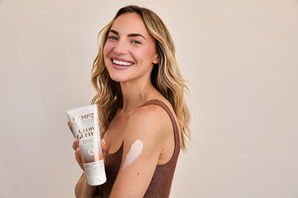 Hempz in-hand application on arm demonstrating buildable color and hydration