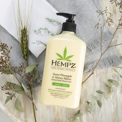 Hempz size comparison next to hand to illustrate 17 oz scale and long-lasting supply