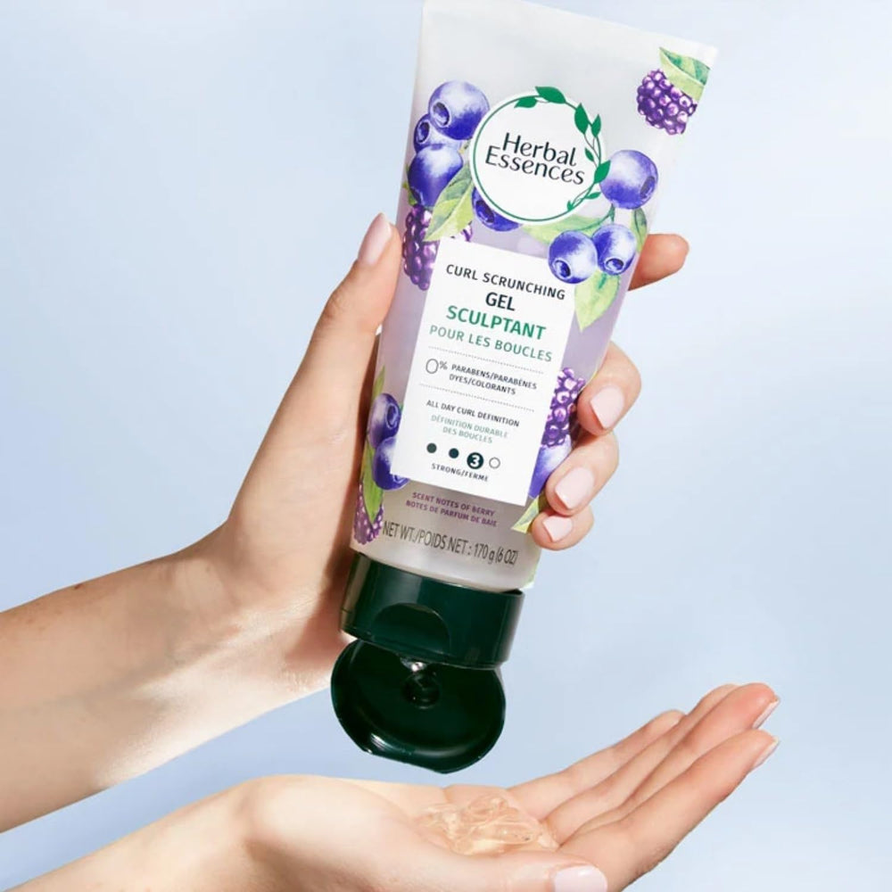 Herbal Essences being scrunched into curls showing defined bounce benefit