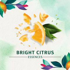 Herbal Essences on bathroom shelf styled with towels, conveys fresh routine and citrus scent