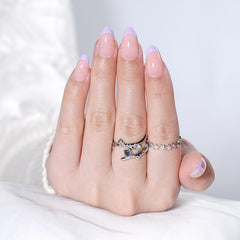 Herlight lifestyle image of woman wearing nails for elegant occasion look