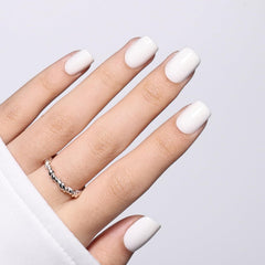 Herlight lifestyle photo of hands wearing white nails paired with casual outfit