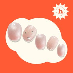 heyhae finished glitter pink nails in lifestyle setting conveying salon-quality shine