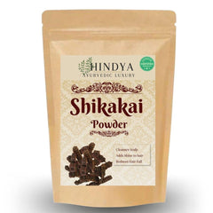 Hindya Ayurvedic Luxury being applied to hair roots demonstrating even coverage and scalp care
