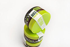 Hip Peas 2 oz jar beside a coin showing compact travel-friendly size