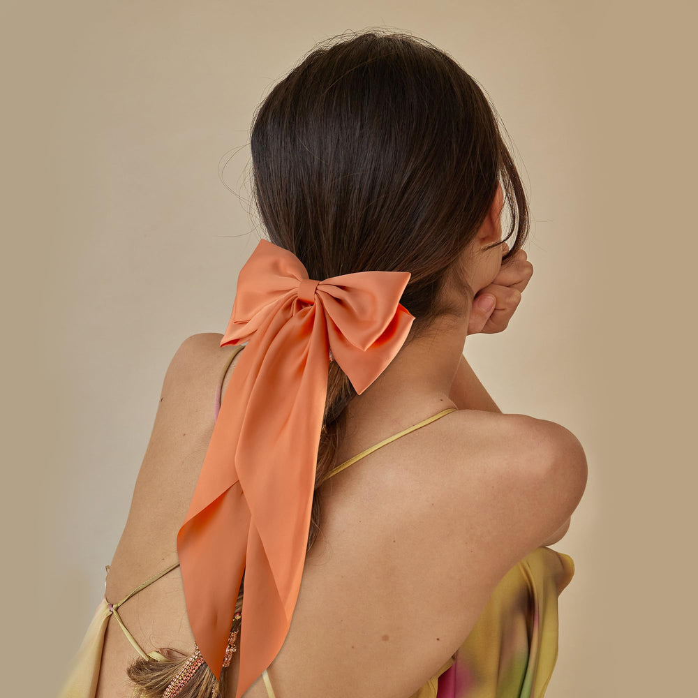 hisial half-up hairstyle example with bow, framing the face elegantly