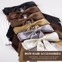 hisial bow beside a hand for scale showing compact size and easy wearability