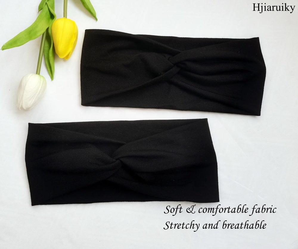 Hjiaruiky headband beside a hand for scale showing comfortable size and width