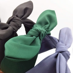hodooly headband held in hand to show size and stretch fit benefit
