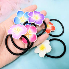 Honbay floral hair tie anchoring a low bun, neat comfortable hold