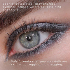 Honeybee Gardens charcoal shimmer stroke on skin demonstrating rich pigment payoff