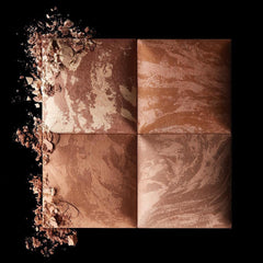 Brush picking up Hourglass bronzer demonstrating easy application and buildable color