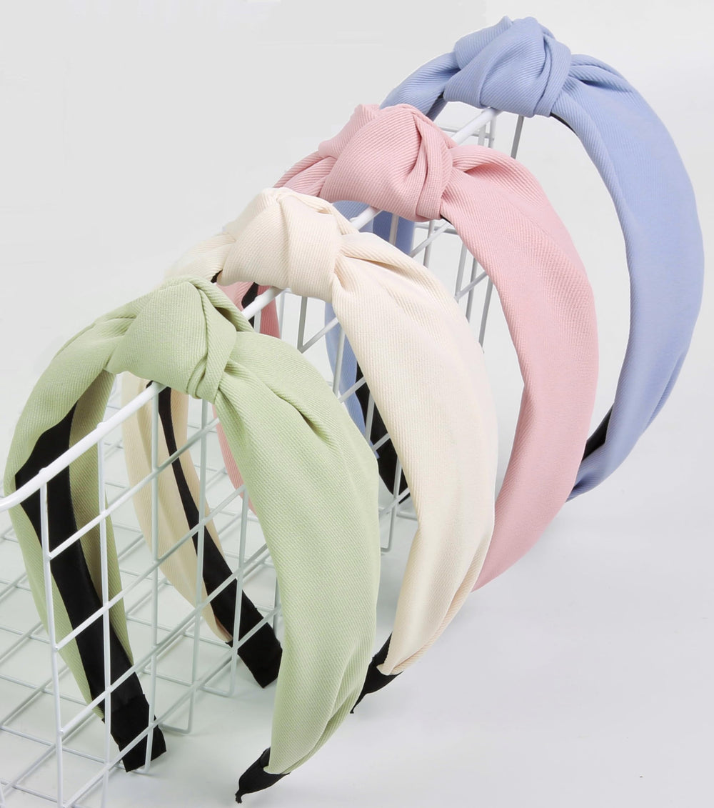 Huachi front view of four pastel headbands showing colors and packaging benefit: easy outfit coordination