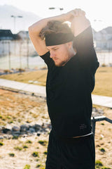 Huachi headband in hand to show scale and lightweight, portable design
