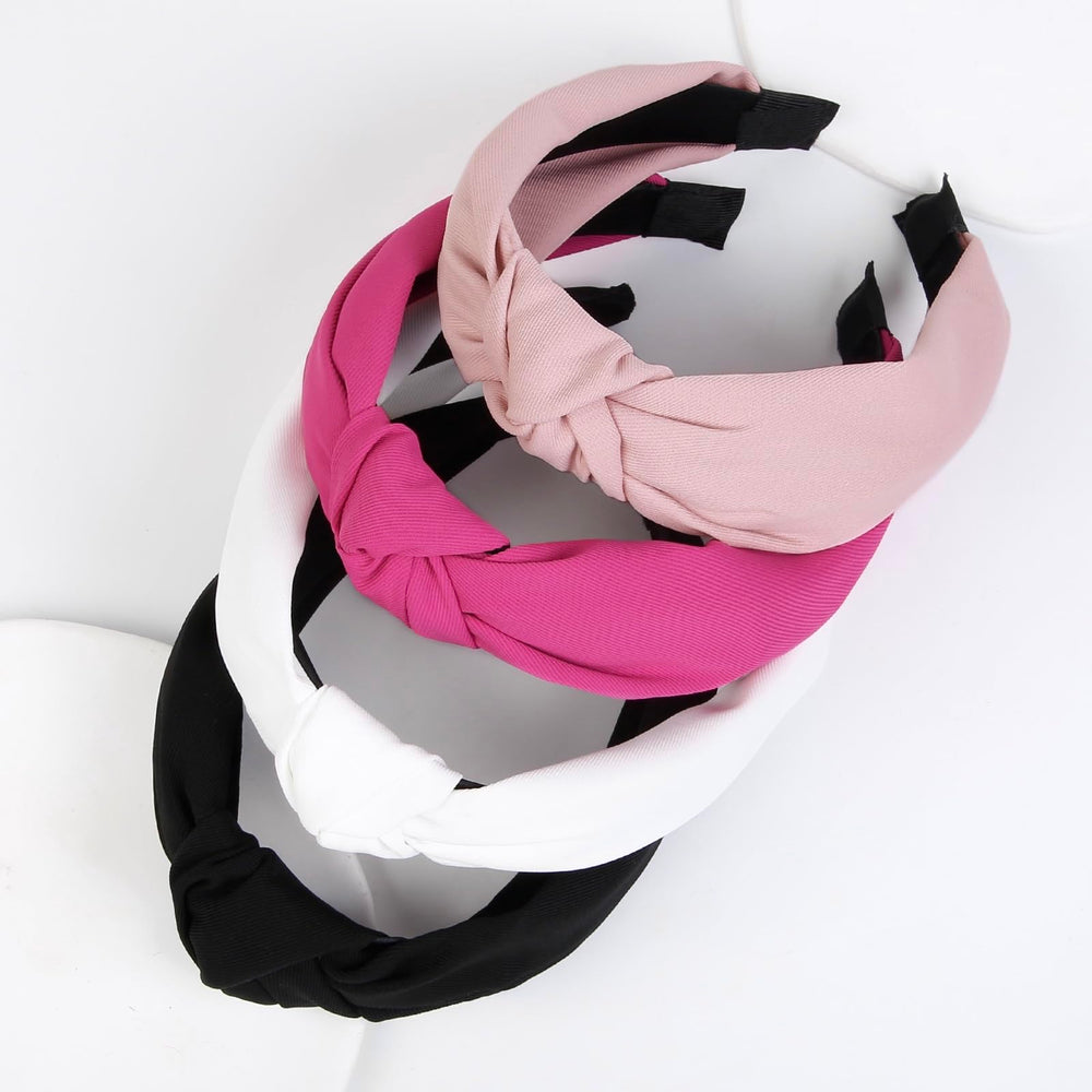 Huachi headband held in hand showing scale and easy portability