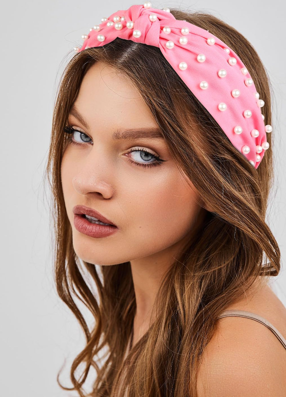 Huachi woman wearing hot pink headband demonstrating comfortable hold