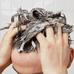 Huron in shower scene illustrating everyday use and fresh scent