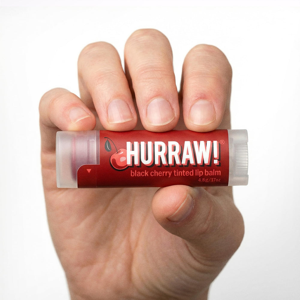 HURRAW! lip balm in outdoor lifestyle scene, conveys natural ingredients and everyday use