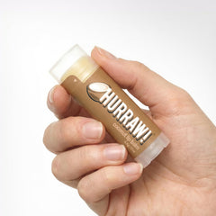 HURRAW! coconut open tube revealing balm surface and coconut richness benefit
