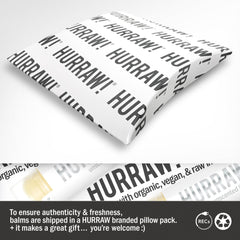 HURRAW! tube held in hand showing size and portability benefit for daily use